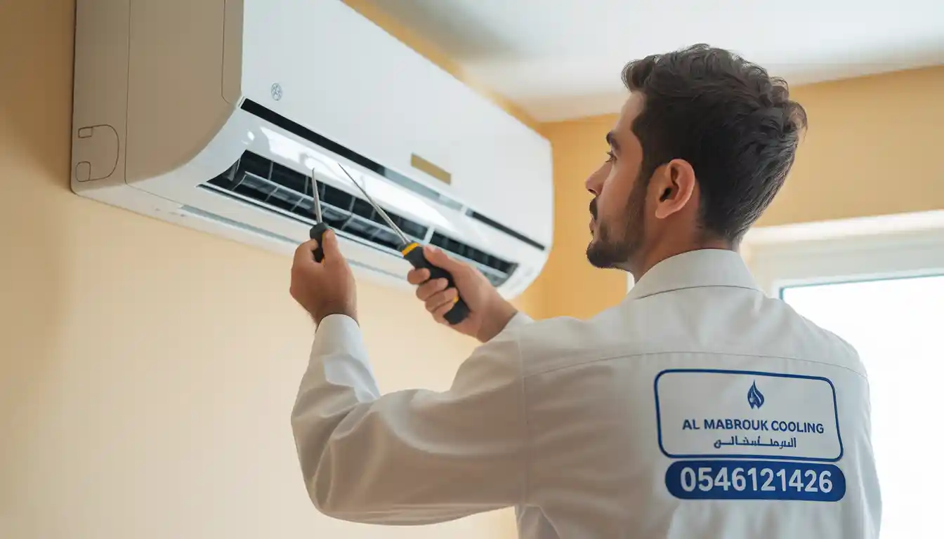 AC repair Jeddah, Al Mabrouk Cooling technician repairing split air conditioner