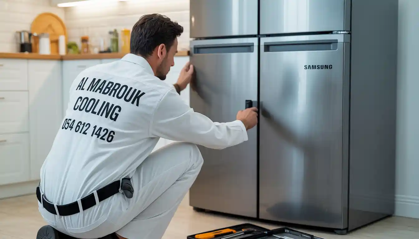 refrigerator repair Jeddah, Al Mabrouk Cooling technician fixing fridge in Saudi kitchen